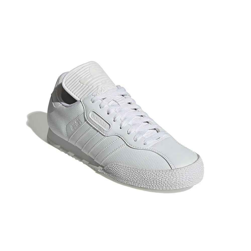 Adidas Samba Super White FZ3848 three-quarter front view showing perforated leather upper and adidas tongue label