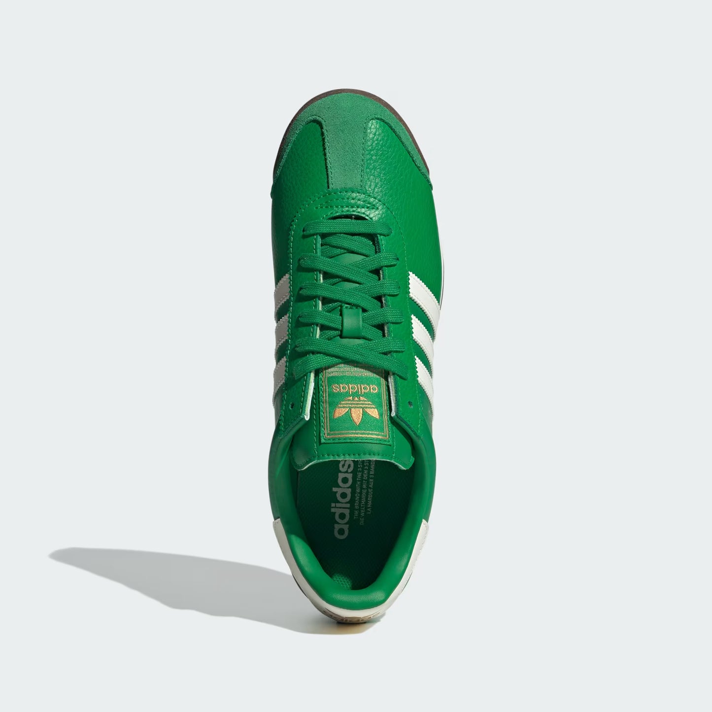 Adidas Samoa Shoes Green JQ0048 three-quarter front view showing leather upper and Trefoil tongue logo