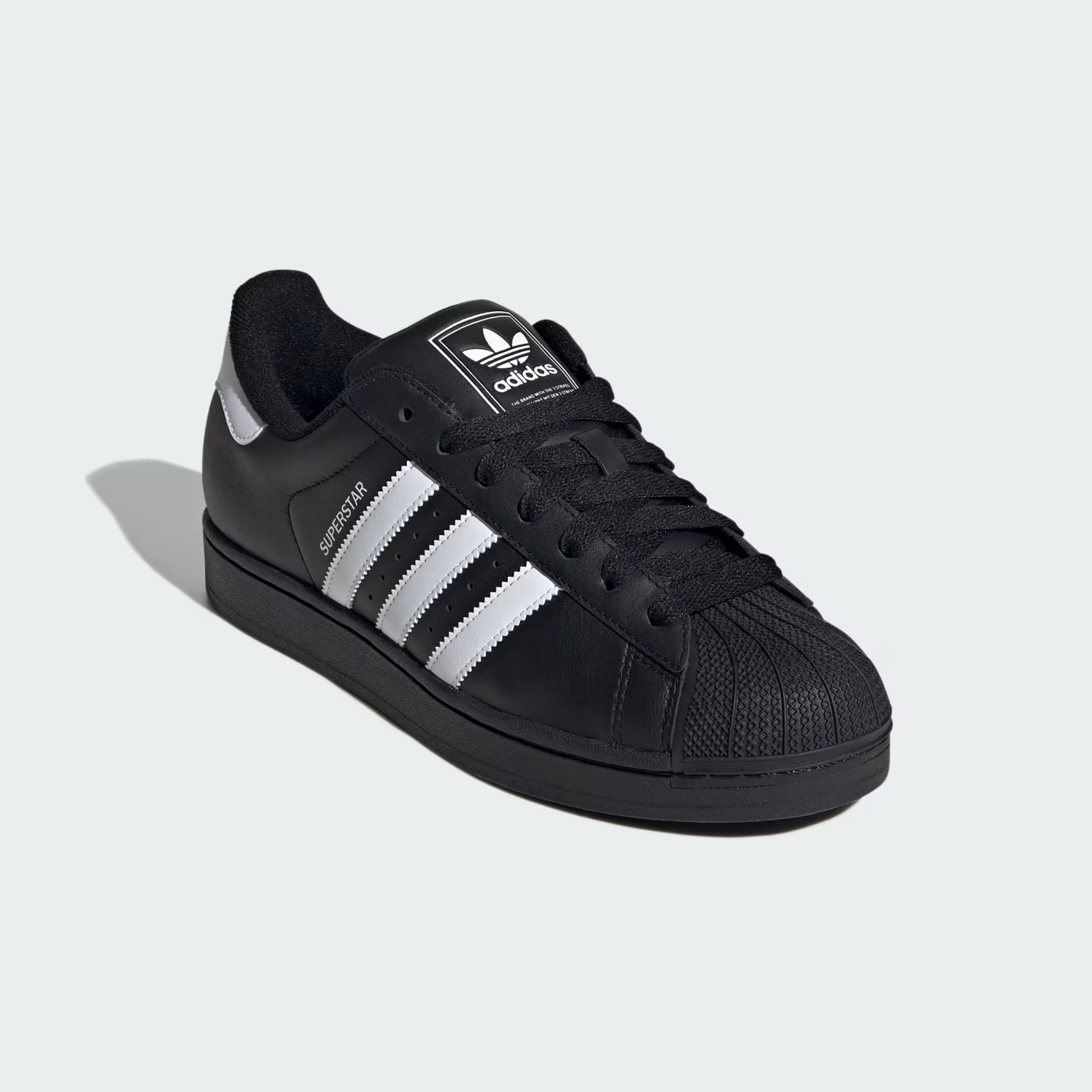 Front three-quarter view of adidas Superstar II Shoes in core black with white 3-Stripes and signature shell toe