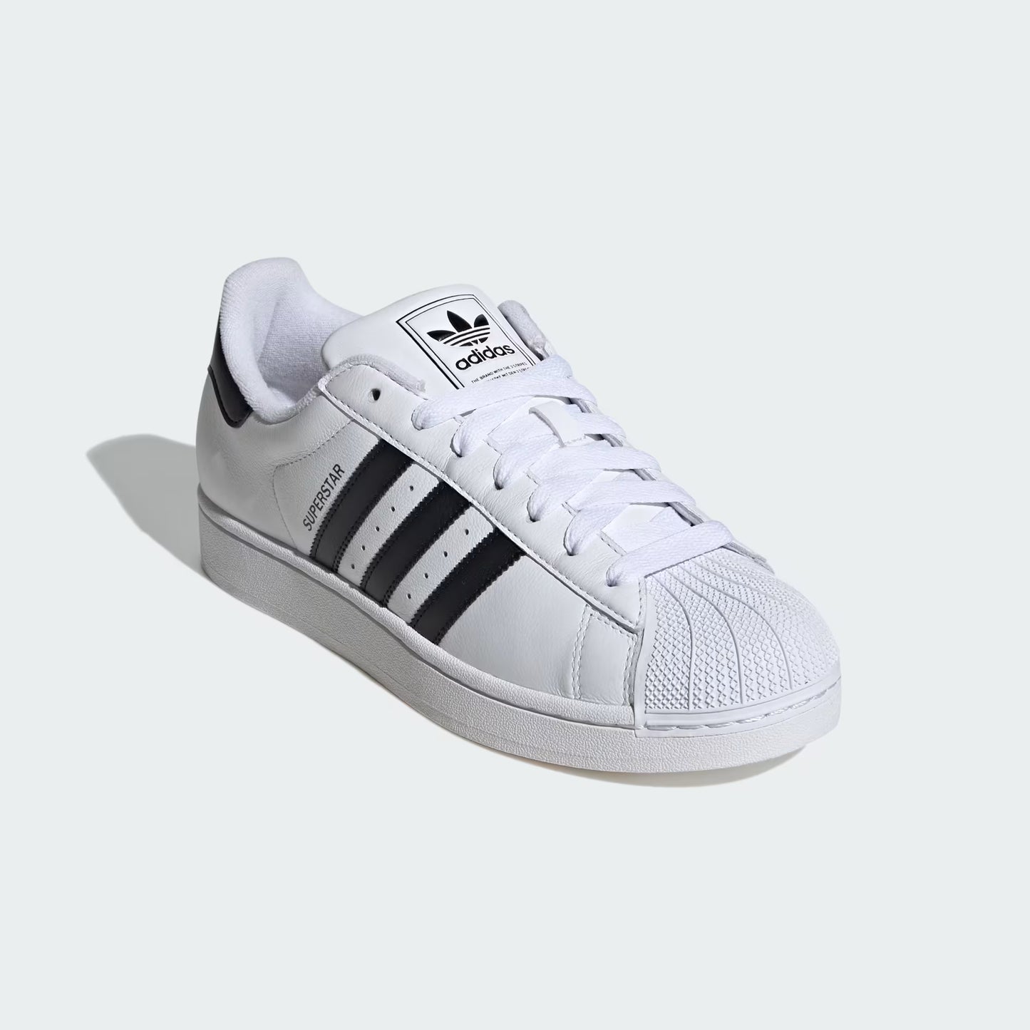 Front three-quarter view of adidas Superstar II Shoes in white with black 3-Stripes and iconic shell toe