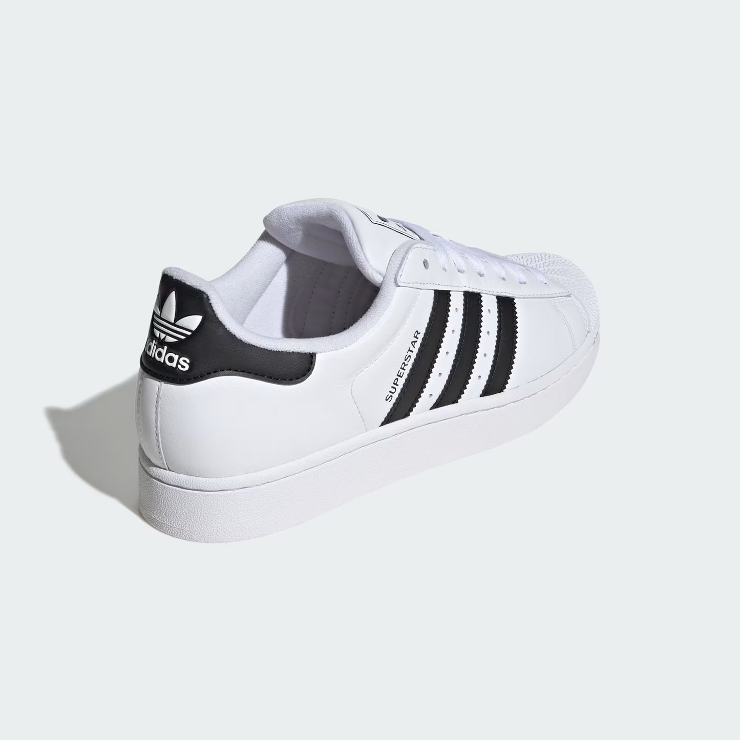 Rear three-quarter view of adidas Superstar II Shoes in white highlighting heel tab and rubber outsole