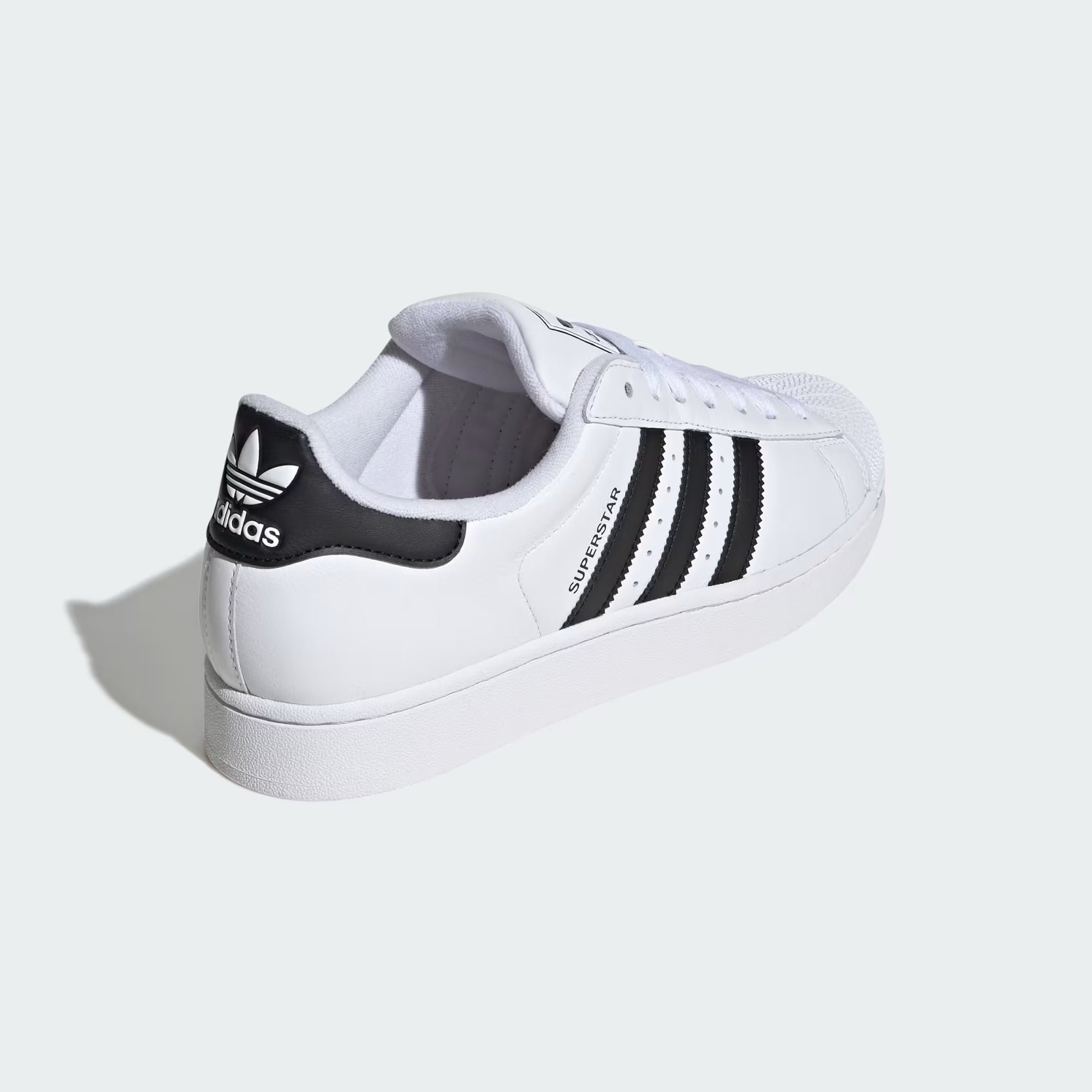 Rear three-quarter view of adidas Superstar II Shoes in white highlighting heel tab and rubber outsole