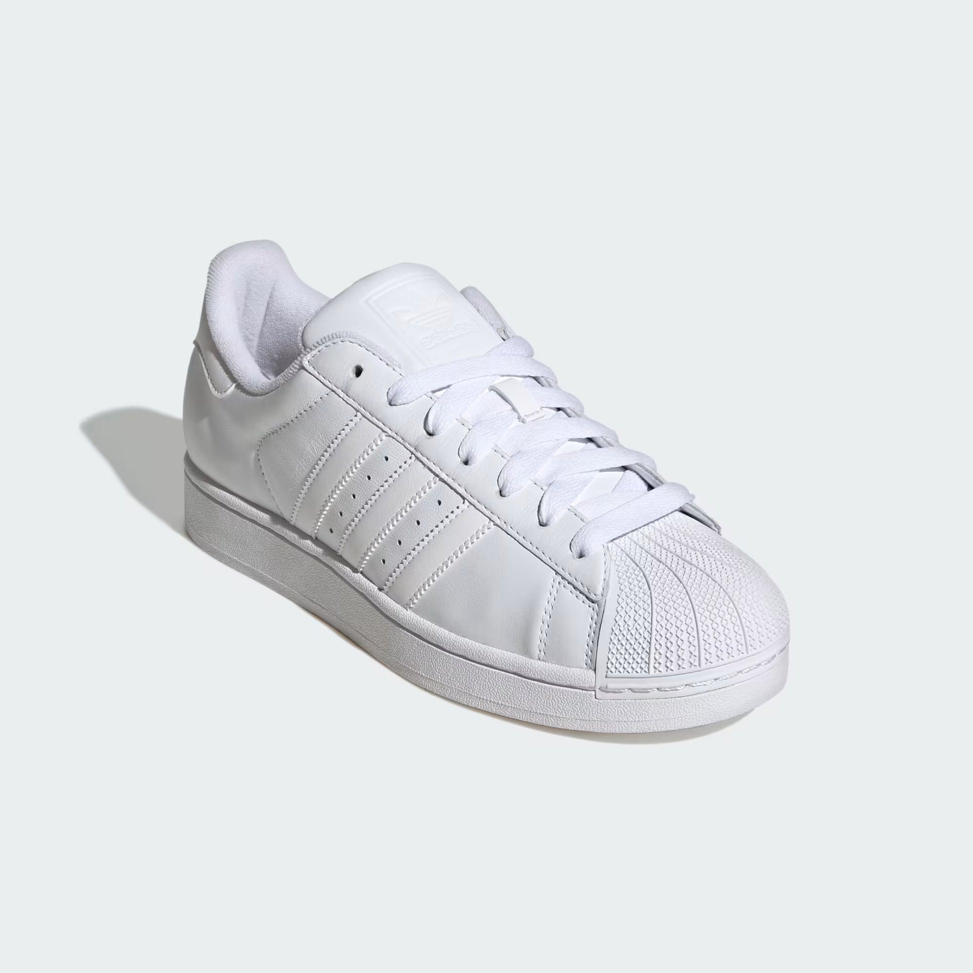 Front three-quarter view of adidas Superstar II Shoes in cloud white with iconic shell toe and low-top design