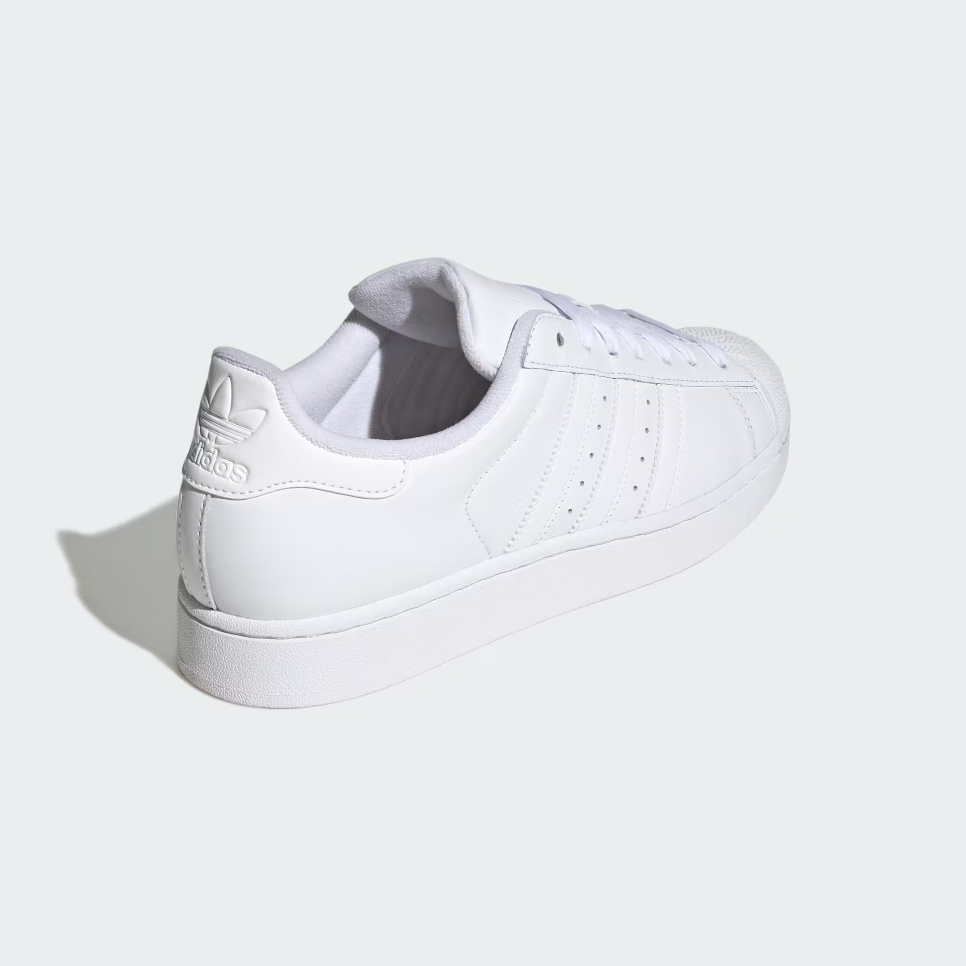 Rear three-quarter view of adidas Superstar II Shoes in cloud white highlighting heel tab and textured rubber outsole